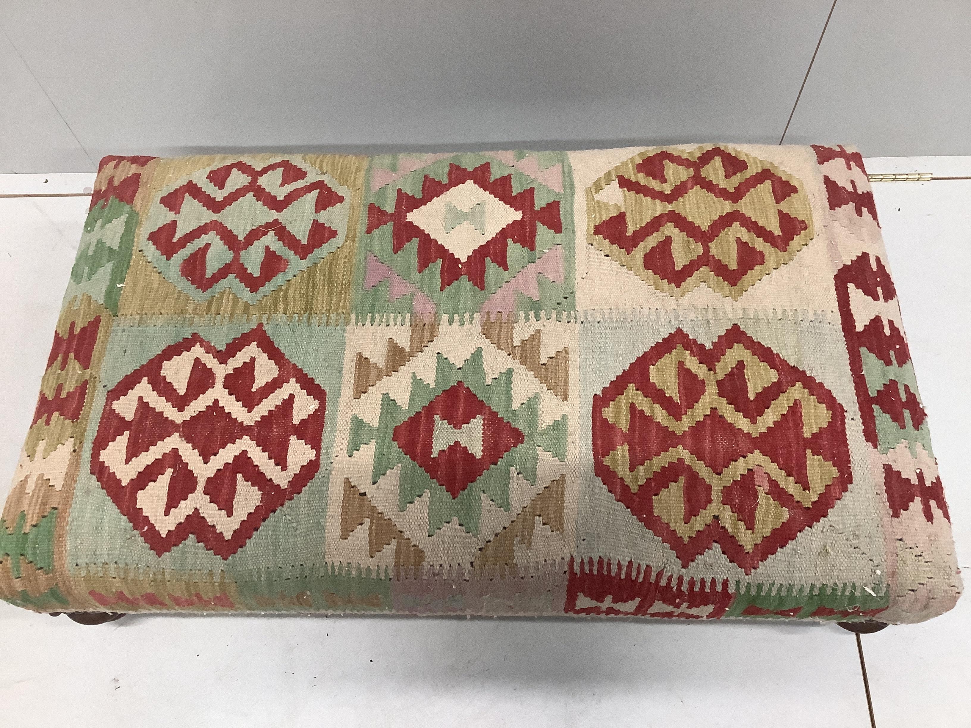 A contemporary rectangular Kilim covered footstool, width 110cm, depth 60cm, height 27cm